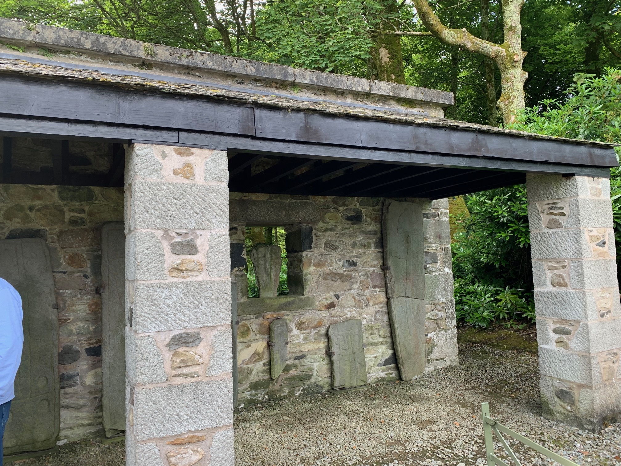Stone outdoor shelter with sculptured stones inside it. 