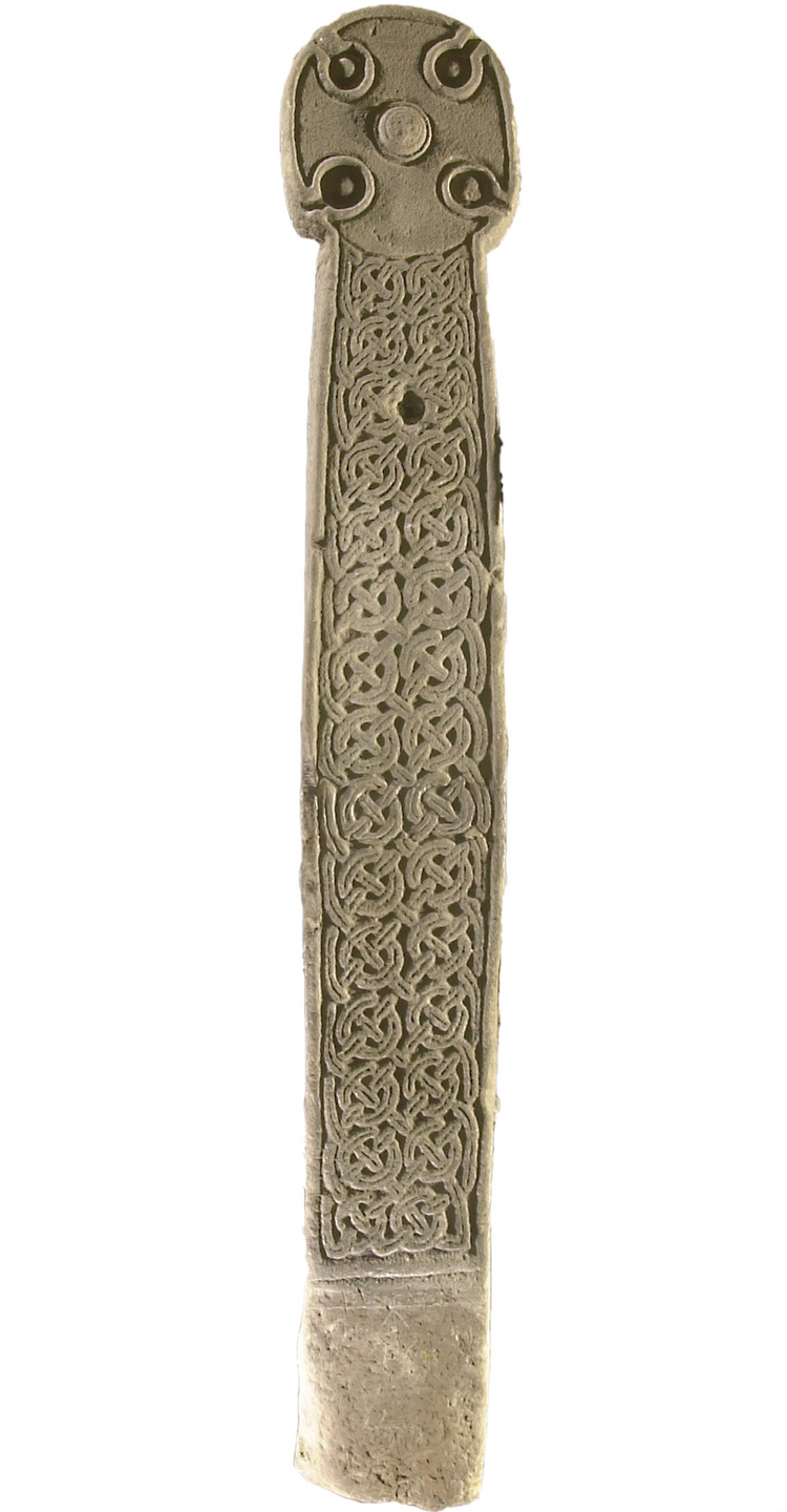 Photograph of a tall carved cross‑slab with a round cross‑head and a long shaft covered in intricate interlaced knotwork.