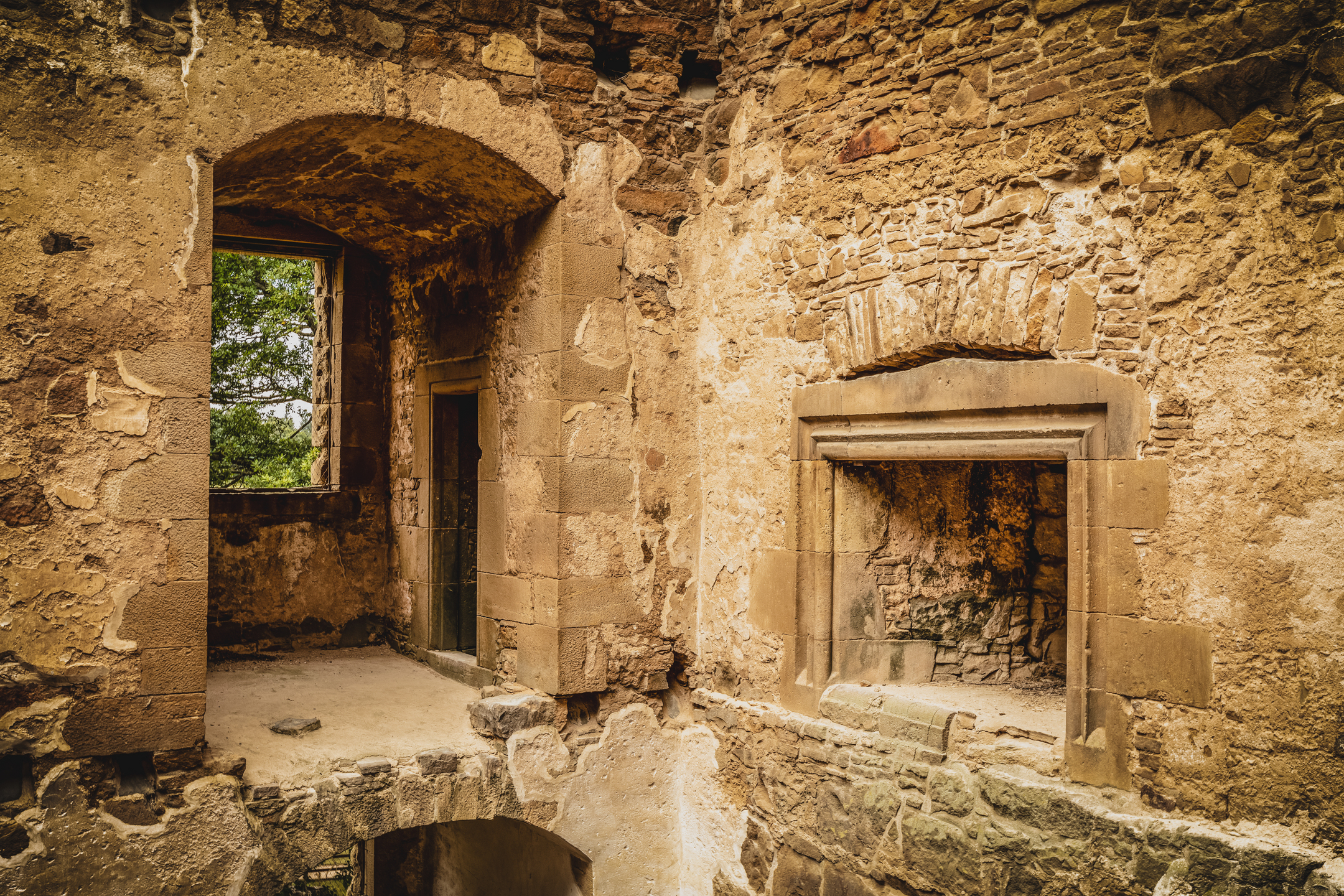 Inside view of Spynie Palace showing a fire place and a window