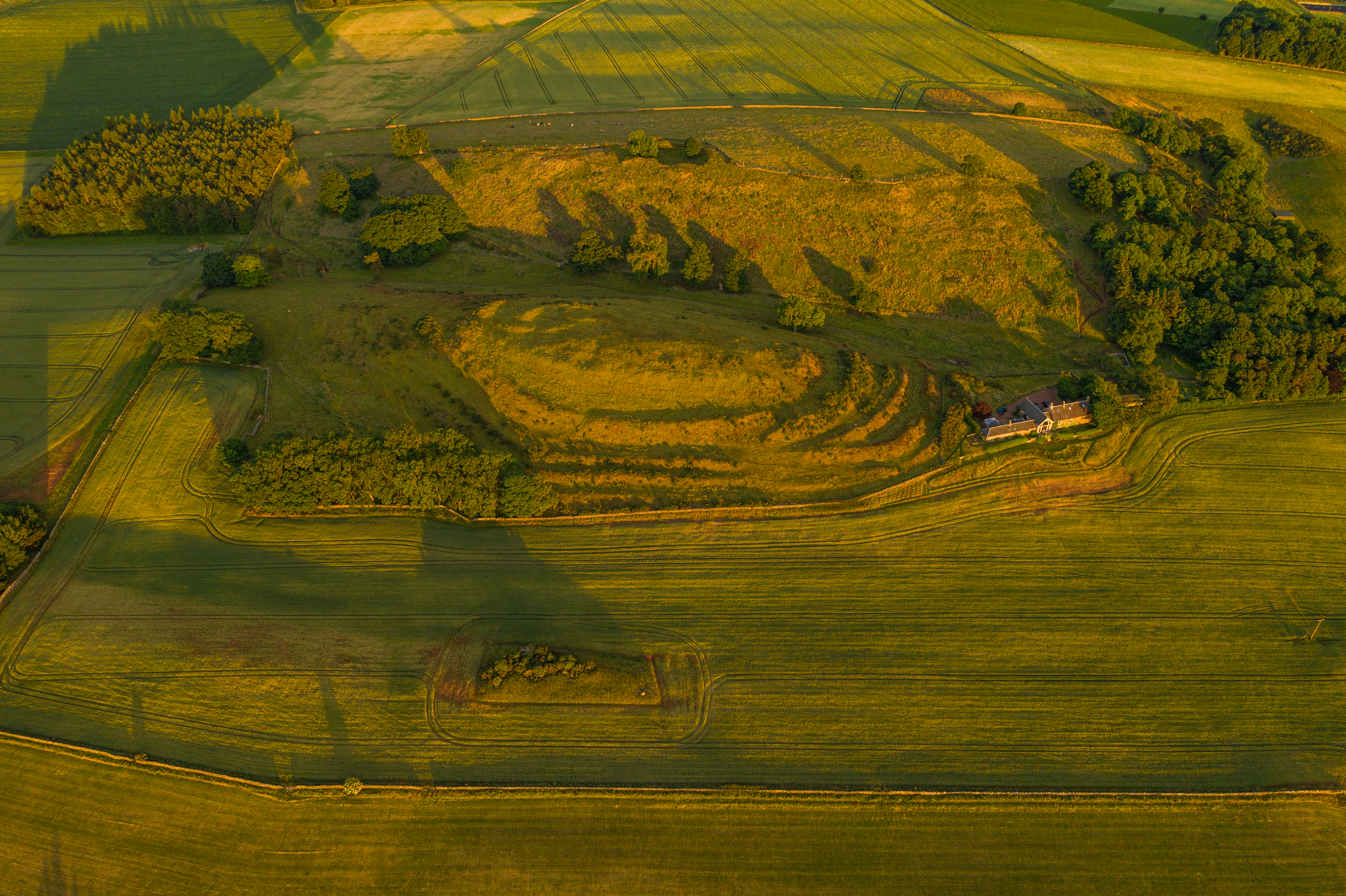 Bird's eye view of Chesters Hill Fort in the golden sunlight