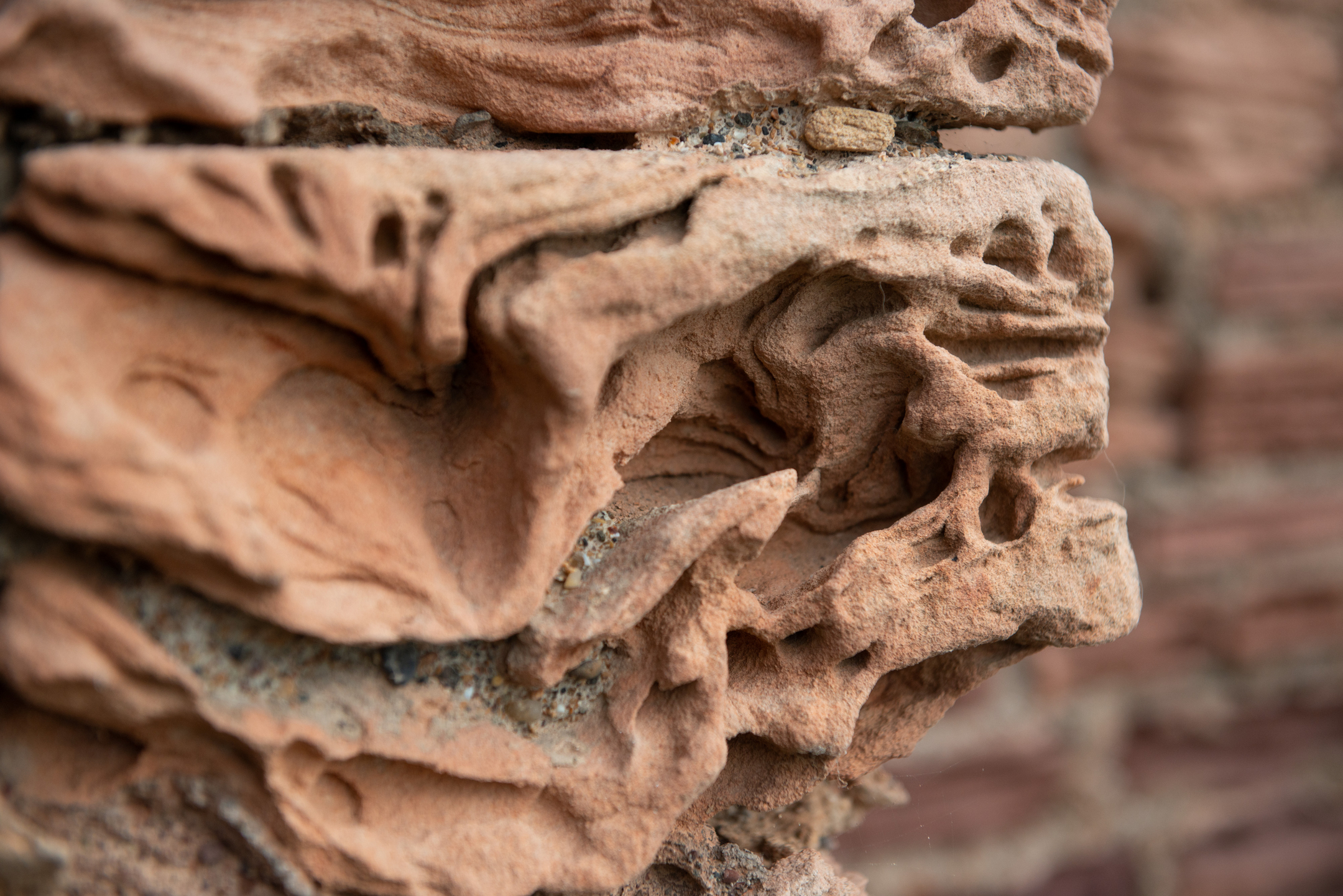 Stonework that shows sign of damage from coastal weather