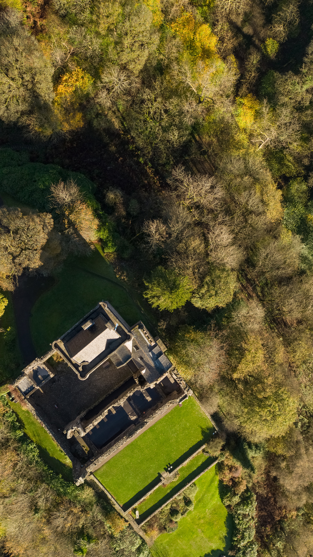 Portrait photo of Castle Campbell UAVhovering directly over the castle. 
