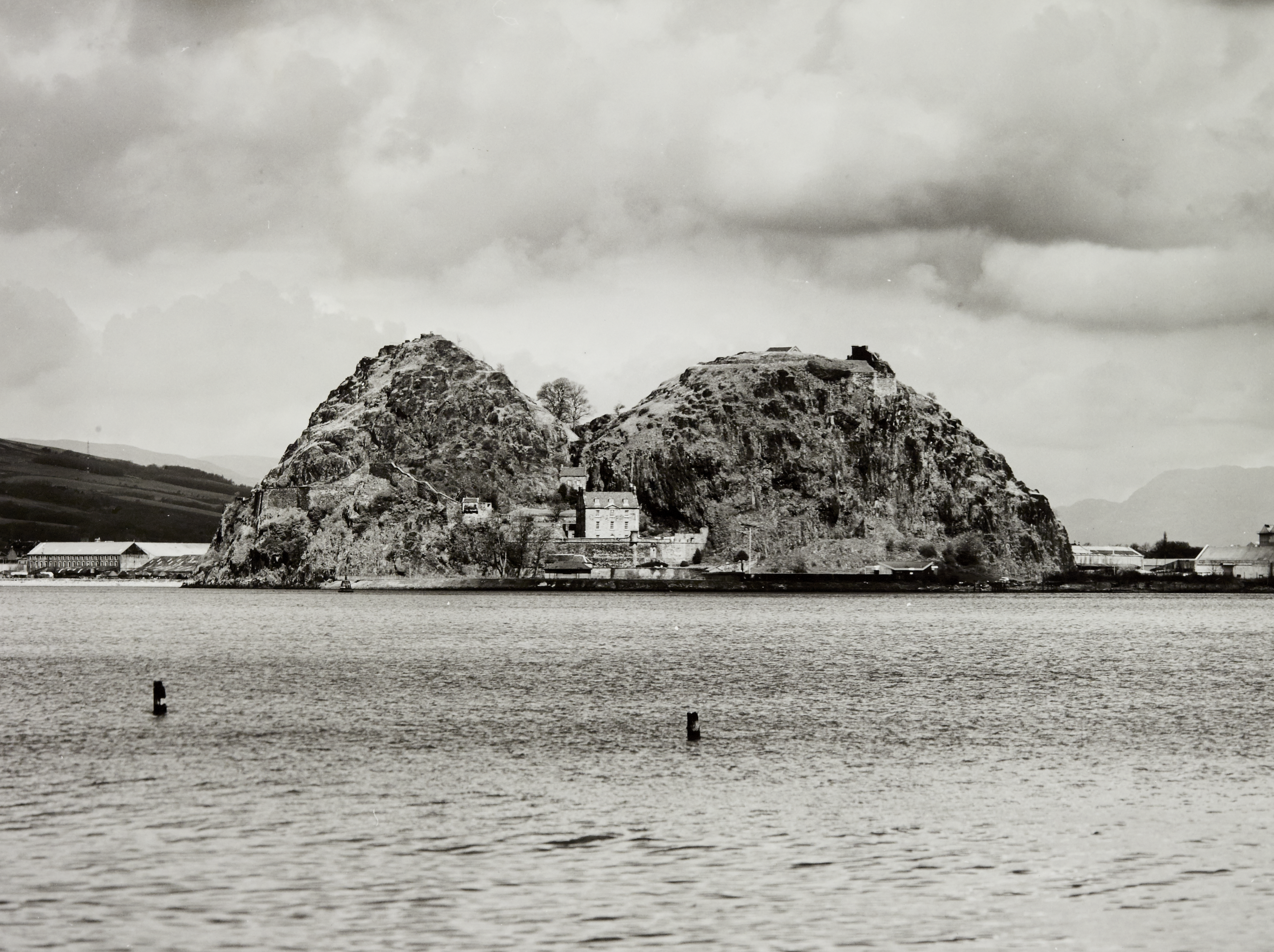 View of Dumbarton Rock from across the water, with part of the castle building clearly visible in the centre