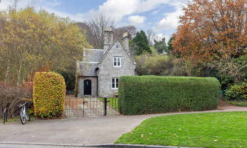 Exterior view of the front entrance of Duddingston Lodge showing garden and driveway - picture #1