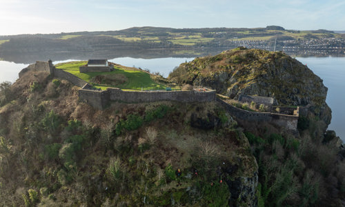 A rope access team working on carrying out de-vegetation on a rock face