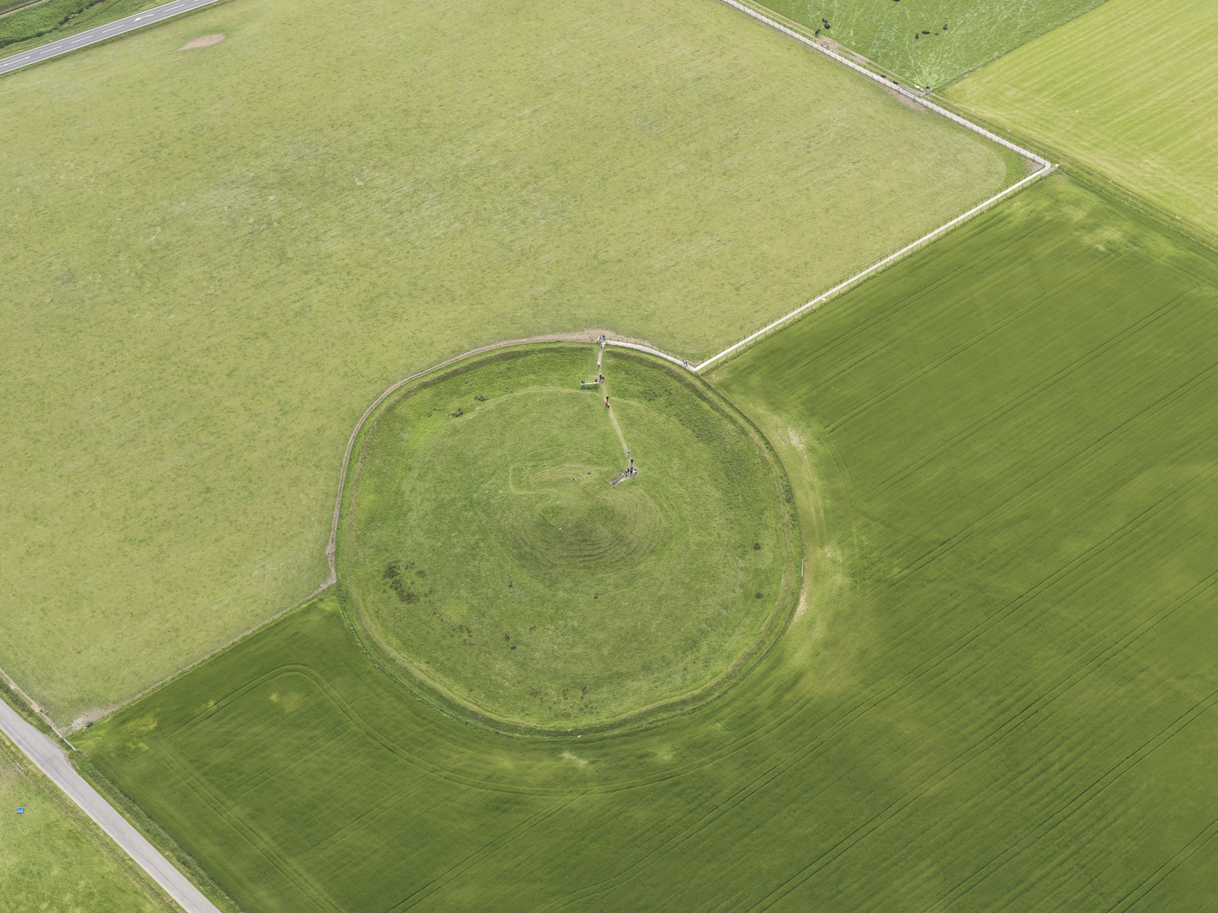 Aerial view of a chambered cairn - creating a circle that intersects two rectangular fields