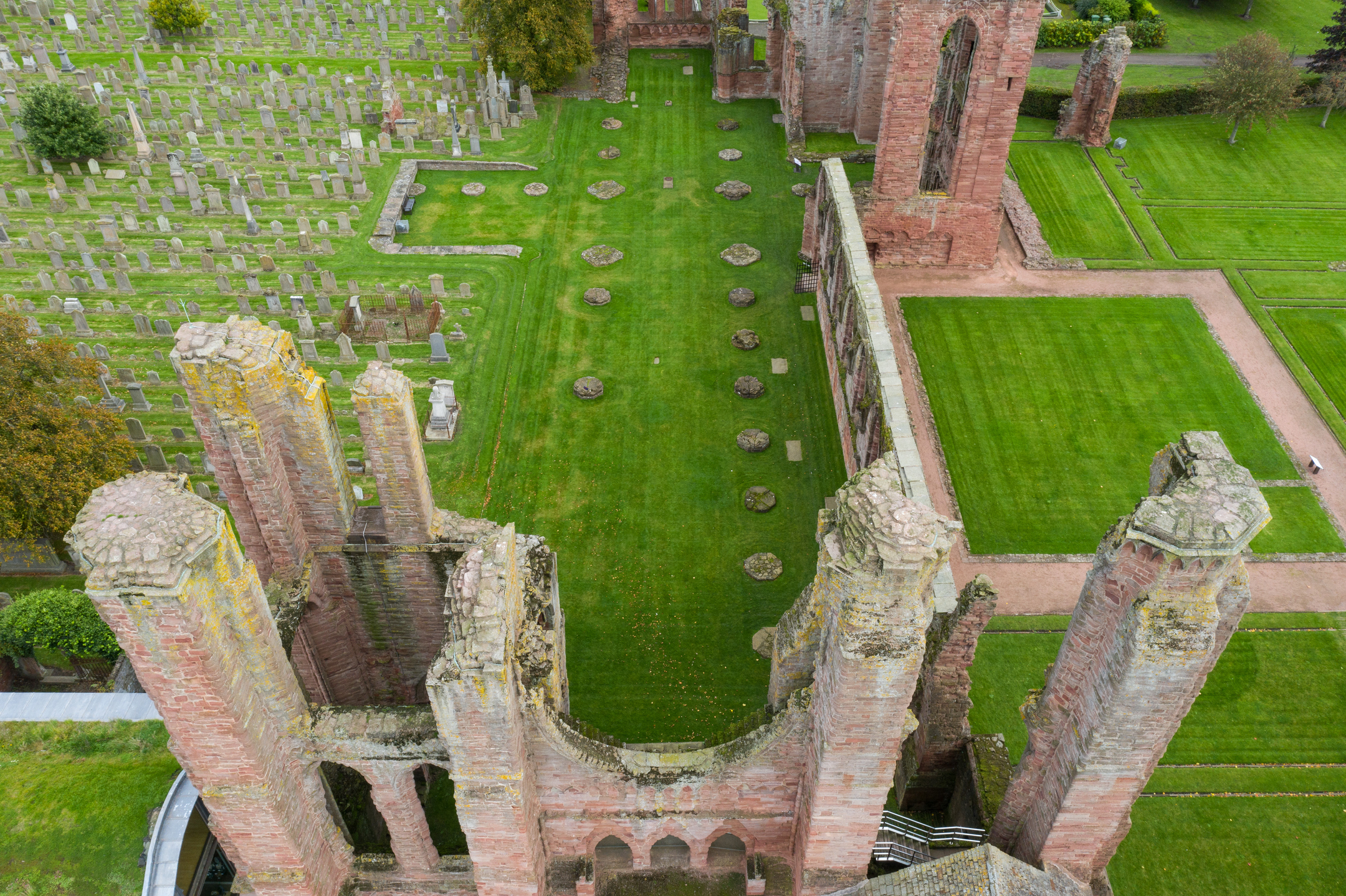 Aerial view of abbey ruin looking down at the tallest remaining section