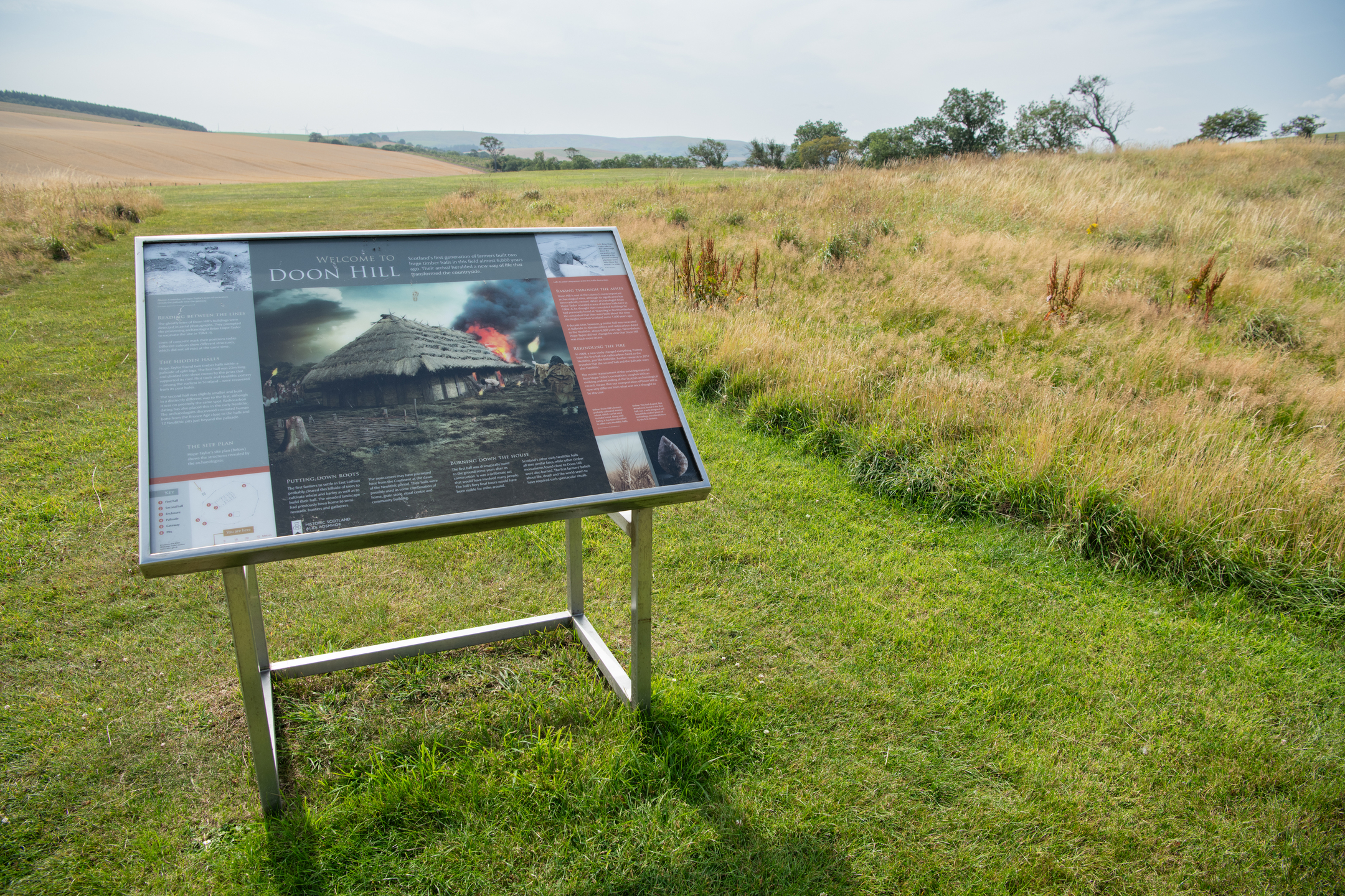 Interpretation panel about Doon Hill in grassy area