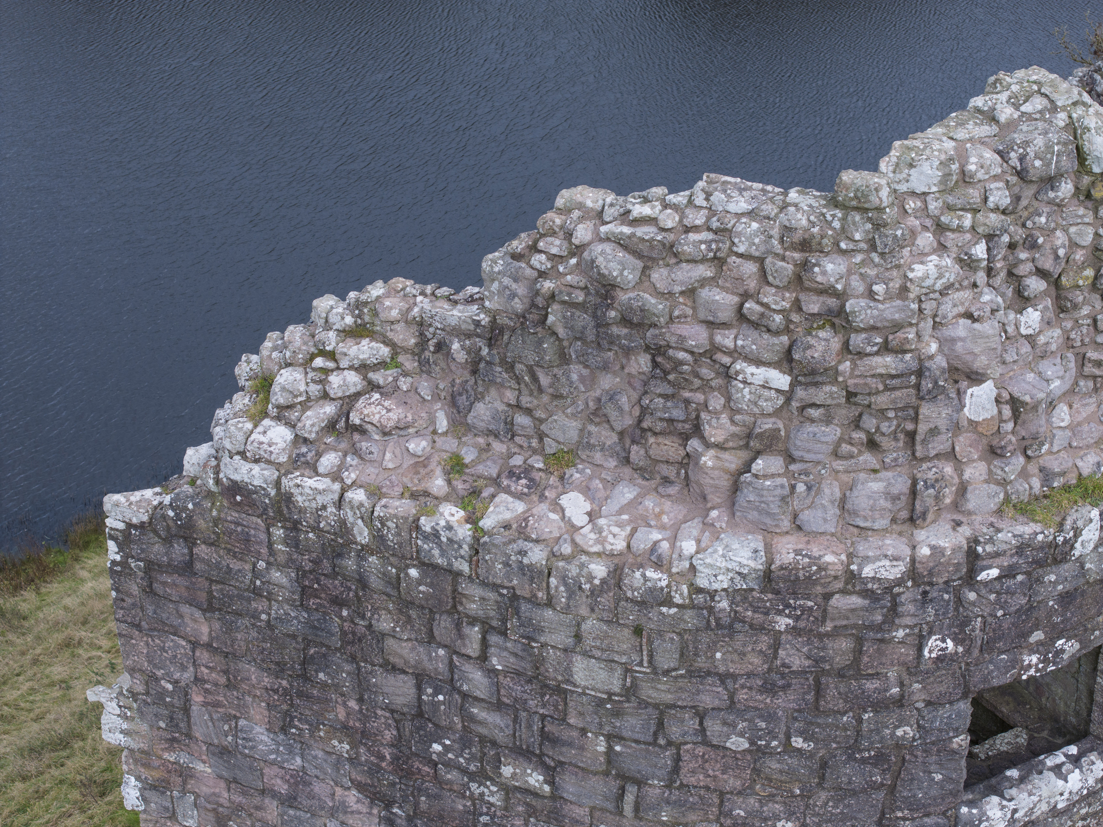 Close up aerial view of w ruined wall at Morton Castle