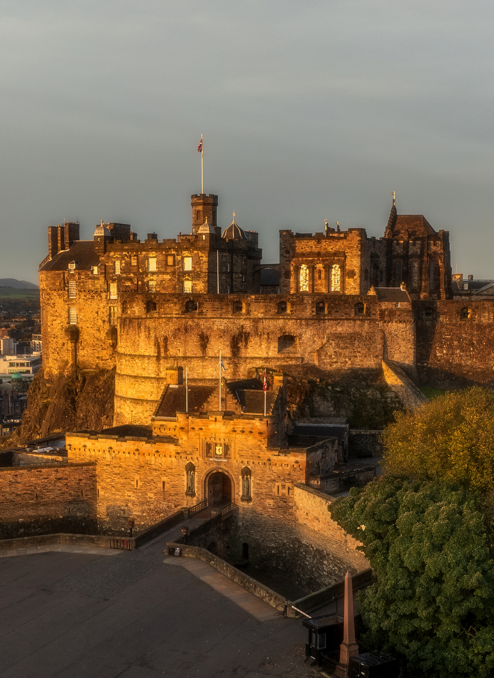 Drone shot of Edinburgh Castle glowing in the sunset