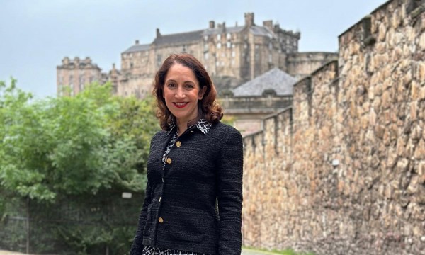 Portrait of Katerina Brown, pictured in front of the Flodden Wall, with Edinburgh Castle in the background.