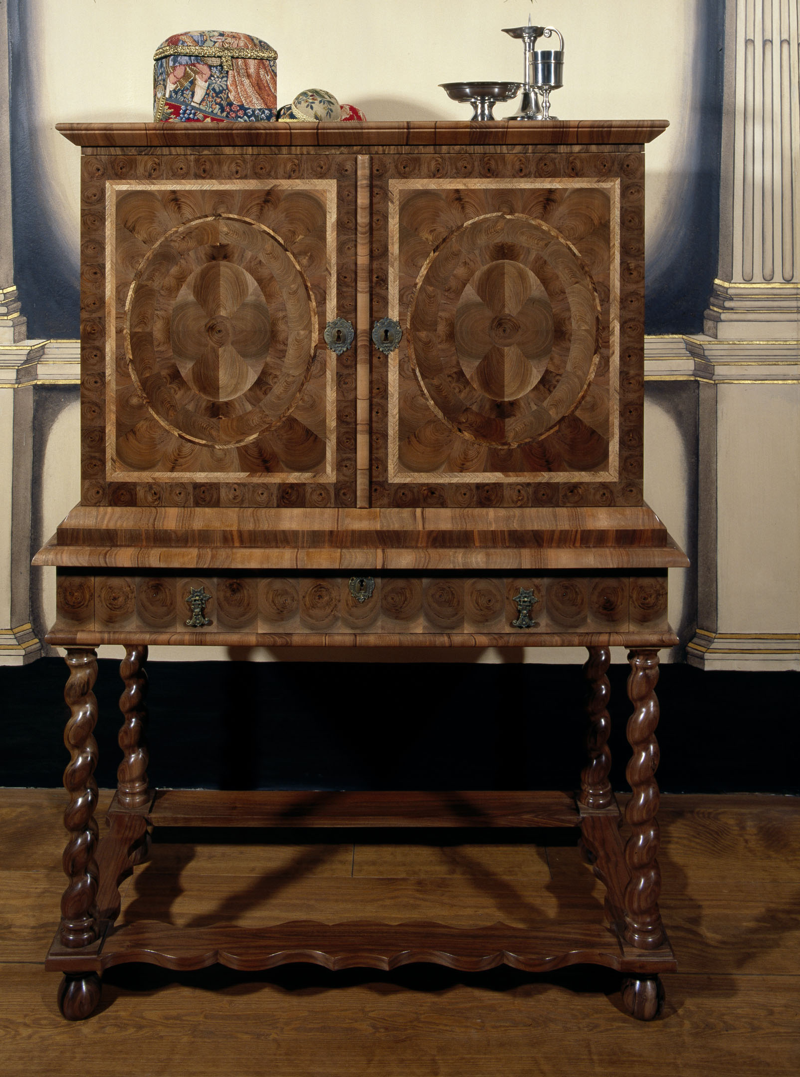 Decorative wooden cabinet with intricate patterns inside Argyll's Lodging.