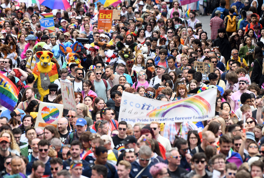 Large crowd of people marching at Edinburgh Pride.