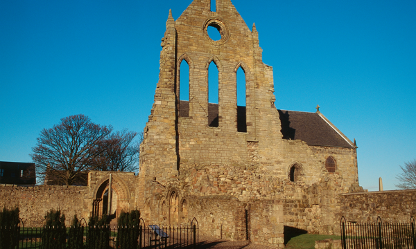 The outside of Kilwinning Abbey on a sunny day 