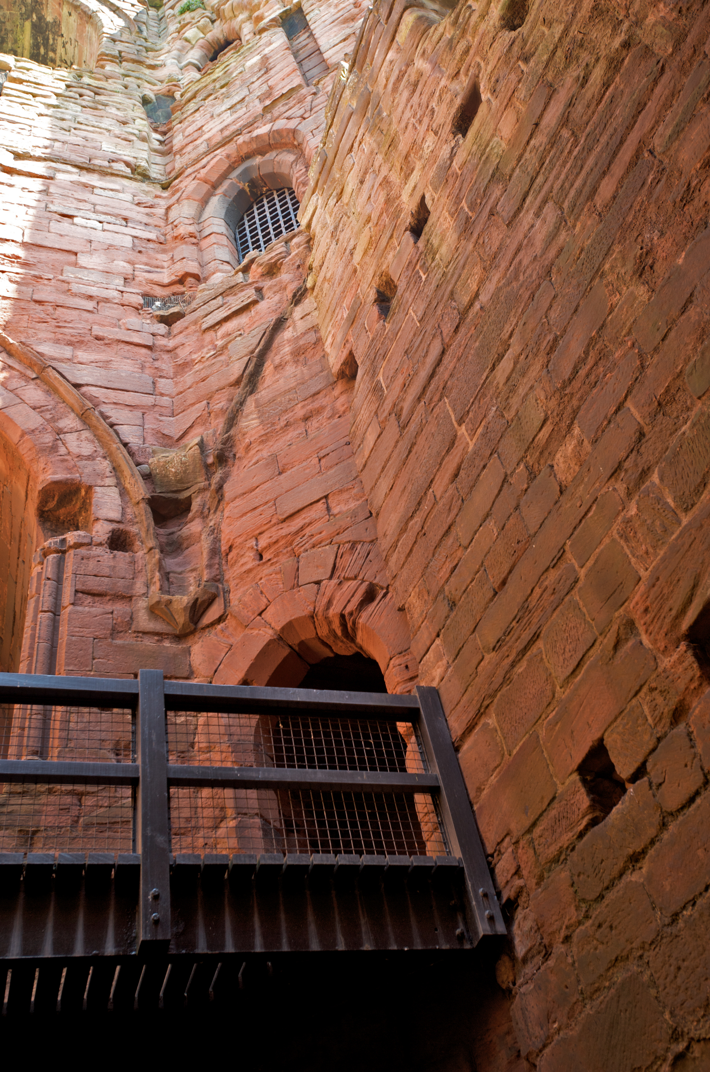 Close up inside Bothwell Castle looking up a doorway and window inside the Donjon