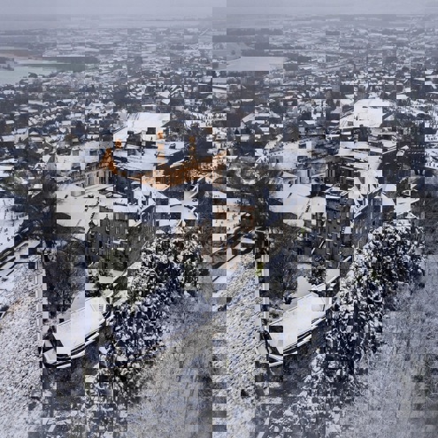 Aerial view of the majestic Stirling Castle in the snow