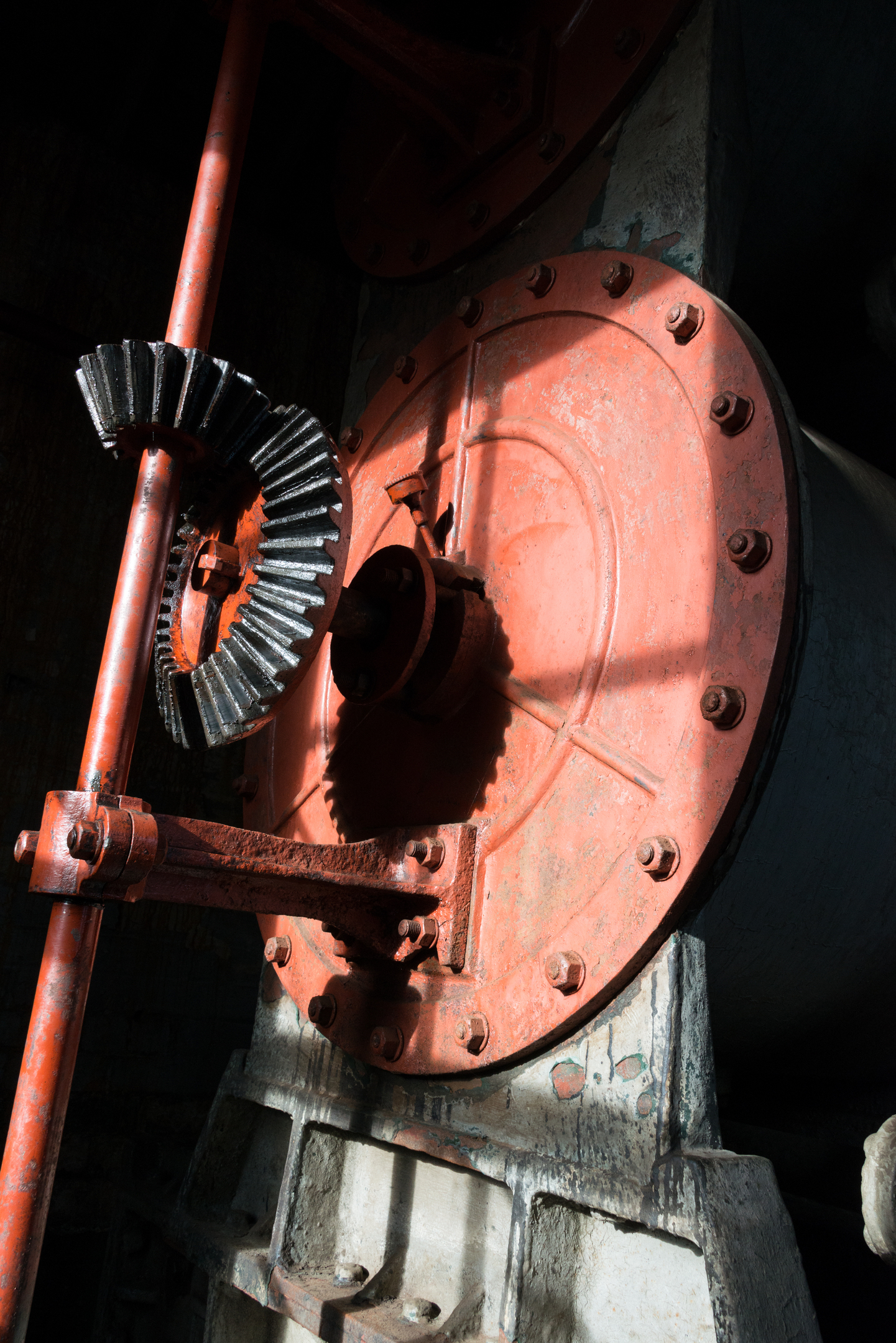 Close-up of red machine with cogs at Biggar Gasworks.