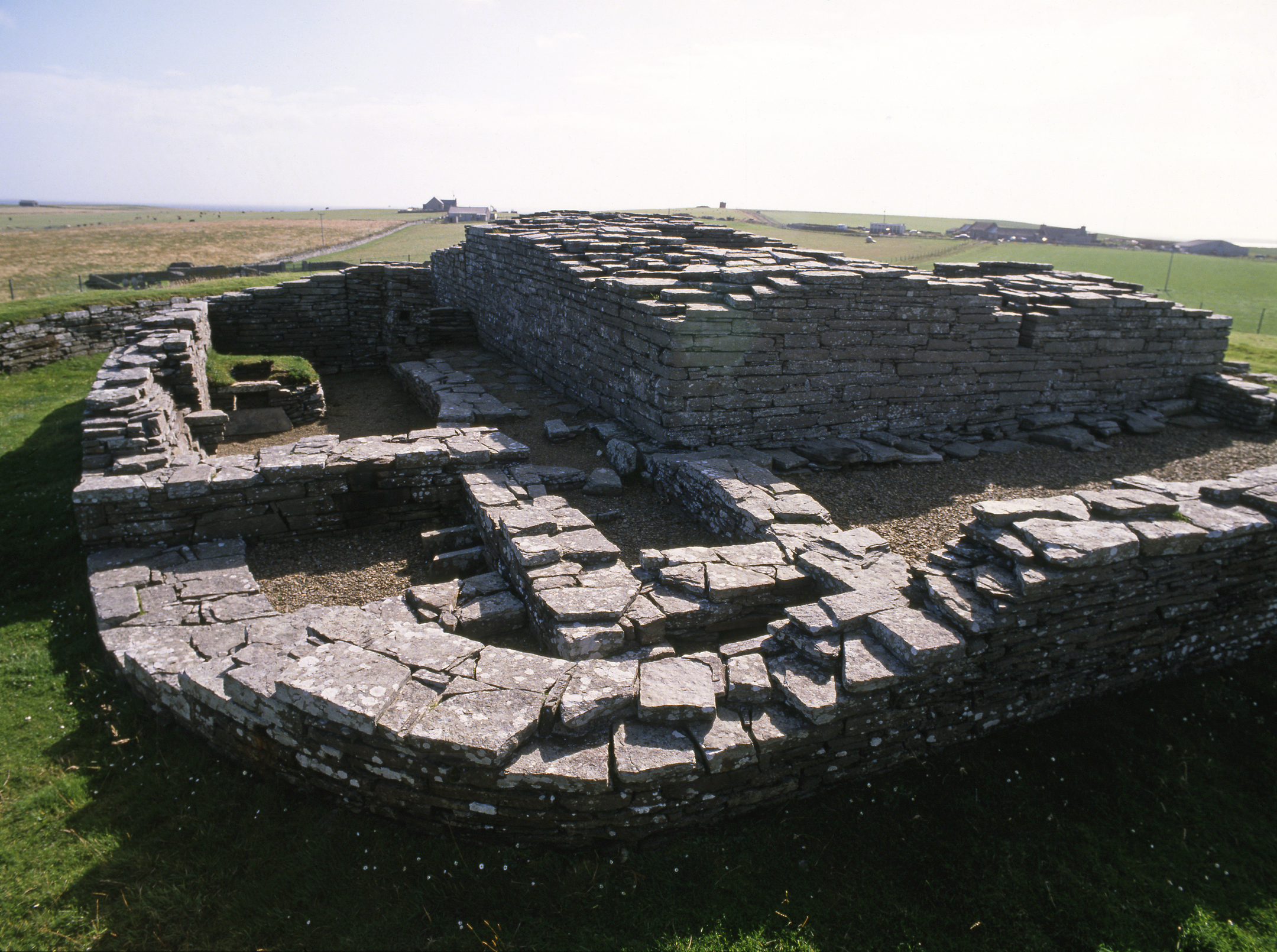 Remains of a castle with walls indicating a layout of rooms and some remaining walls appearing around 2m high