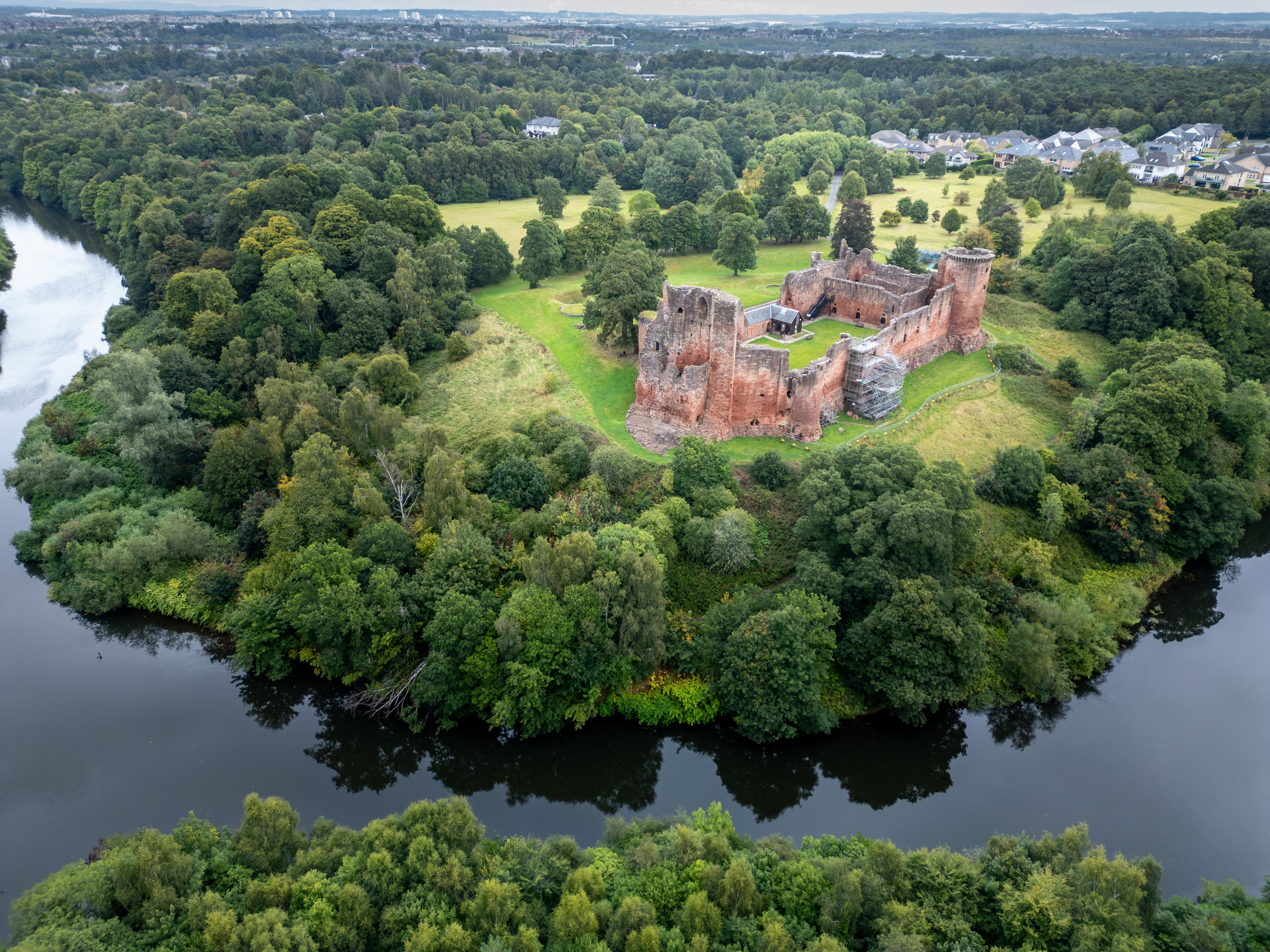 Aerial view of Bothwell Castle and surroundings of the woods and water